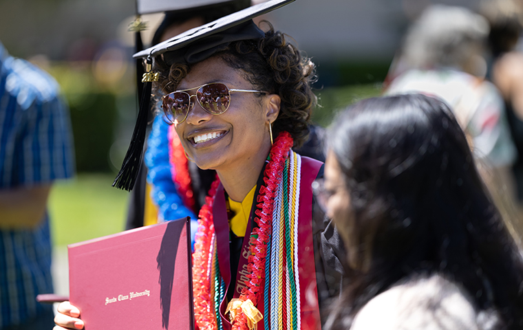 Lady Elizabeth Roy holding degree at Commencement ceremony