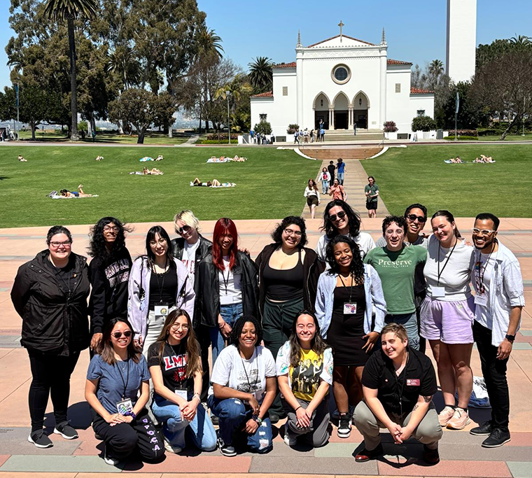 A delegation of SCU students and staff pose in front of Loyola Marymount Universitys chapel.