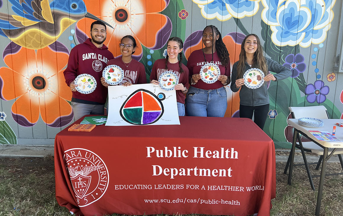 Group of students from SCUs Public Health Department pose at event.