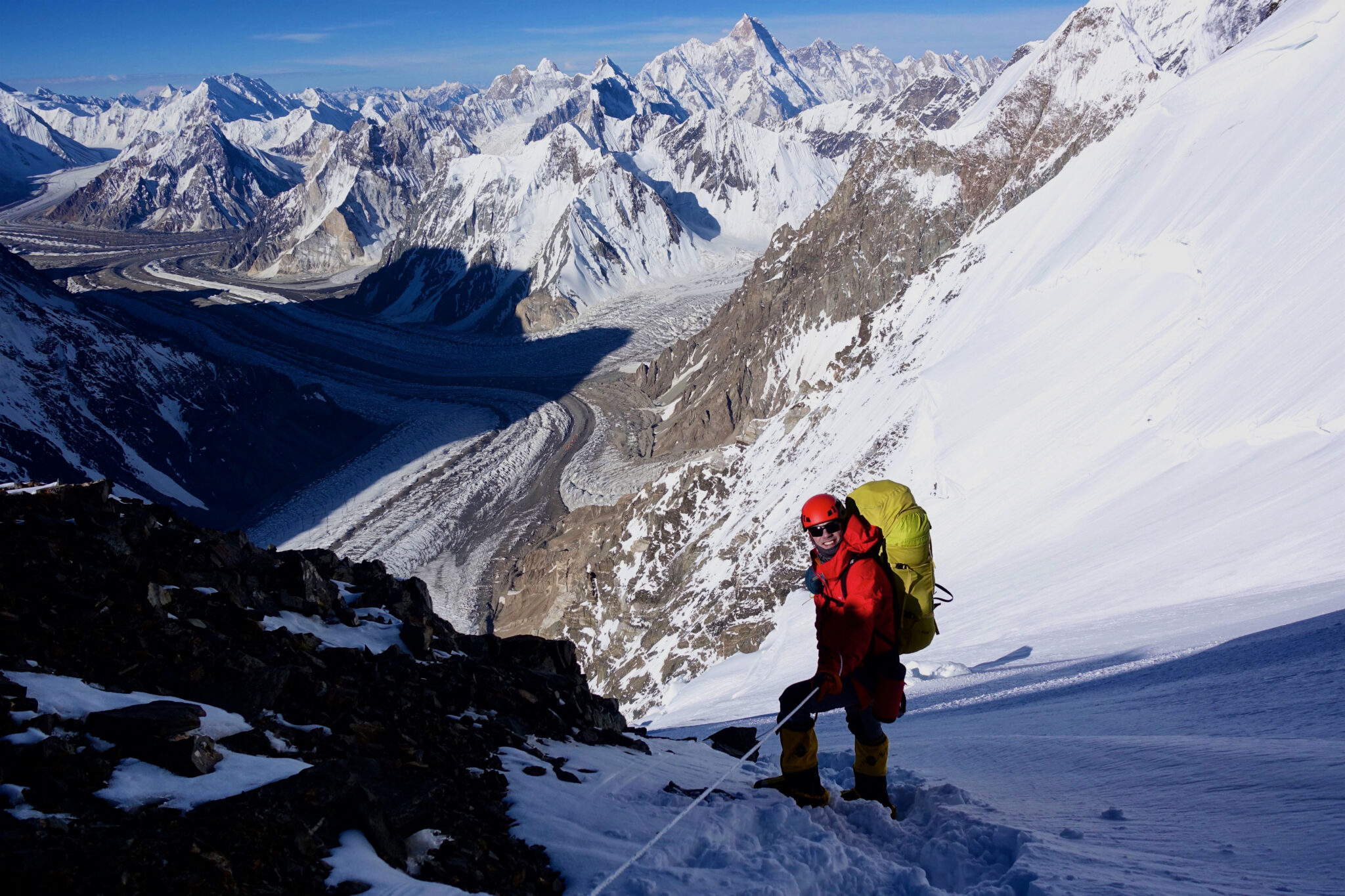 man stands on mountain in snow